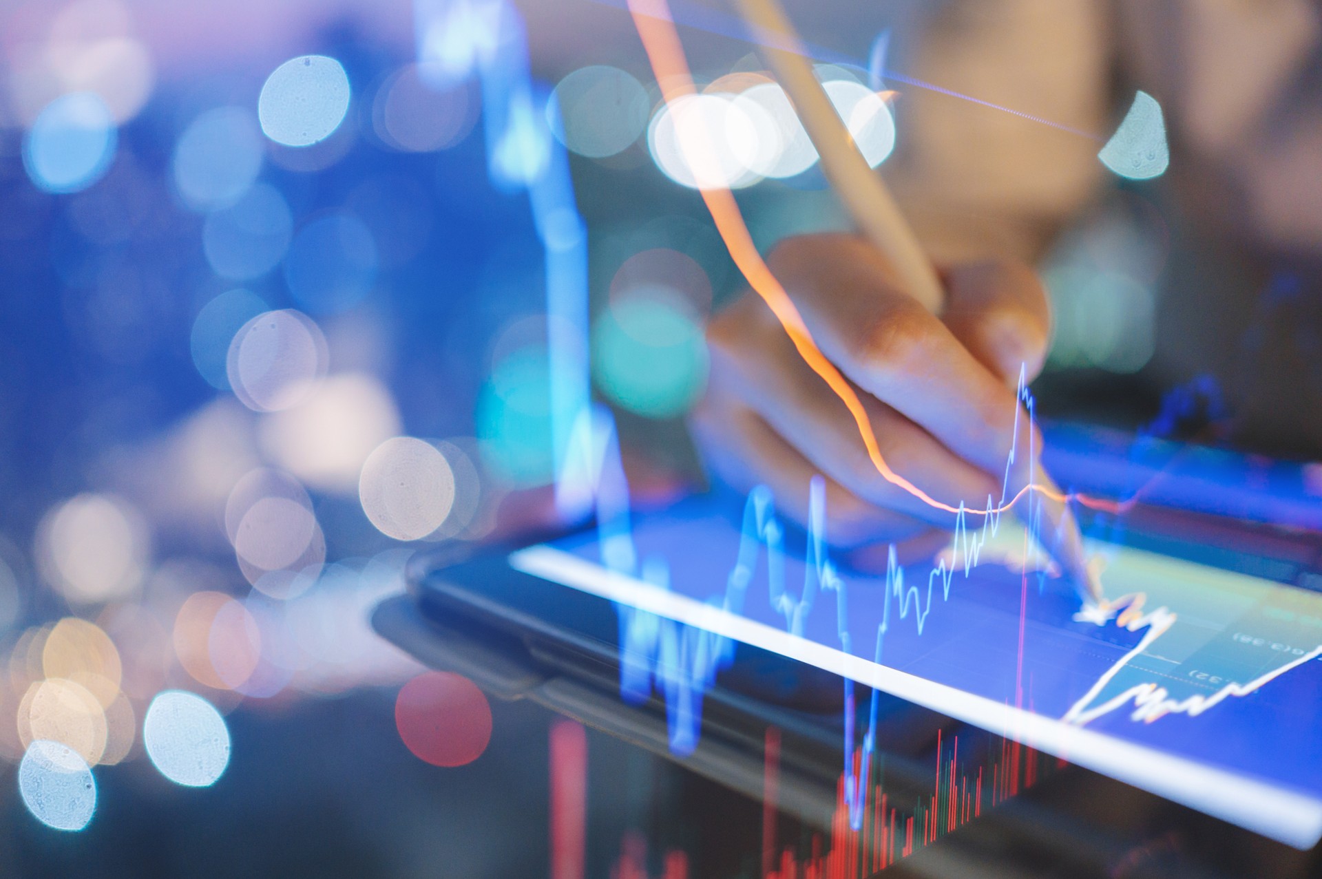 Investor with AI digital display of an automated trading interface, featuring AI algorithms and detailed financial graphs for optimized investments